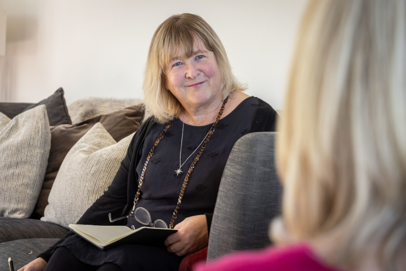 Gill in a conversation, photograph.